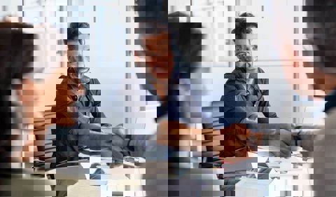 Happy man shaking hands