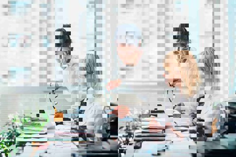 Two women working in an office
