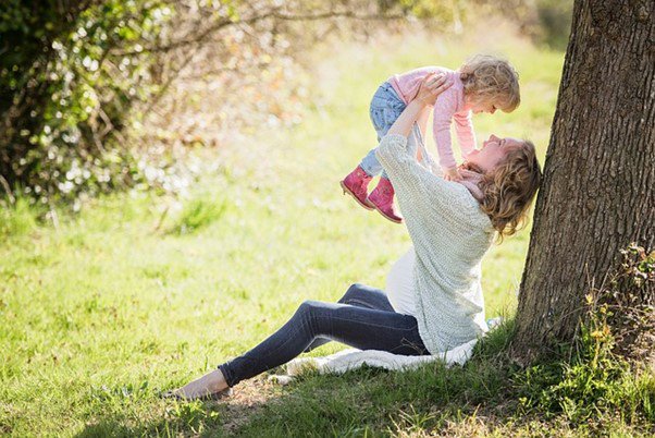 a mother and child out in nature