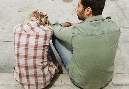 man and woman sat outside