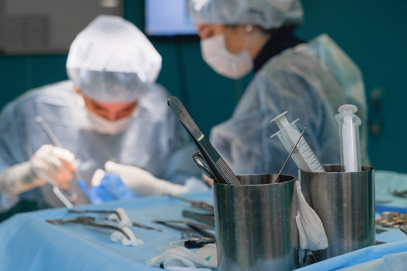 two people performing surgery