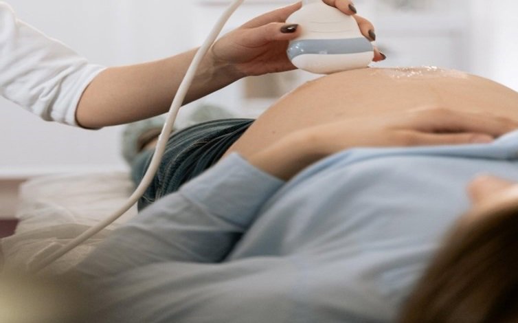 a pregnant woman receiving an ultrasound scan