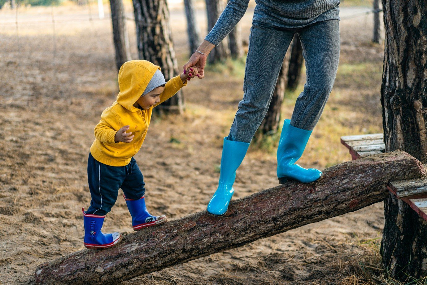 parent and child playing together outside