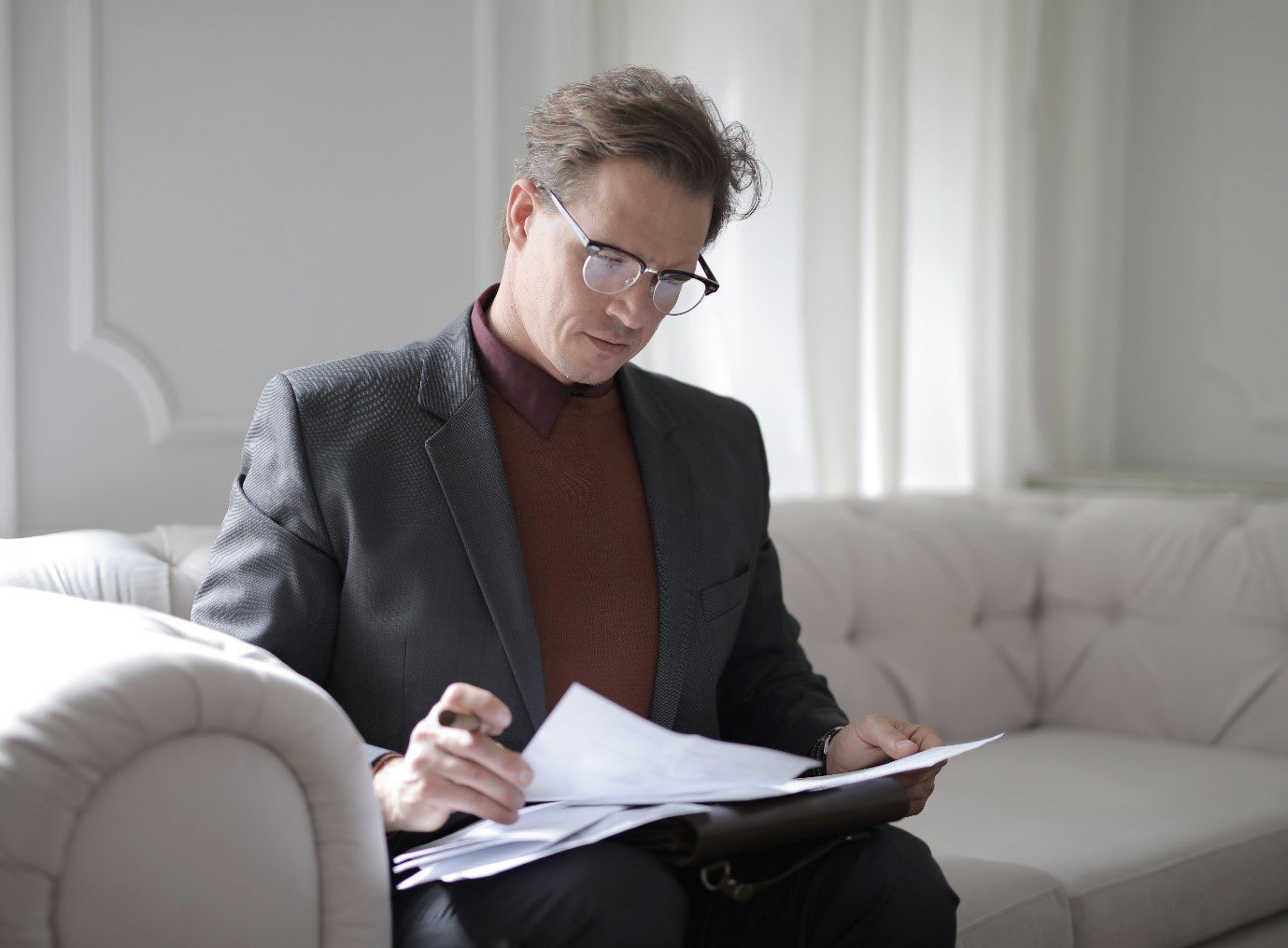 a professional man reading documents