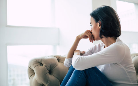 Sad Woman On Sofa