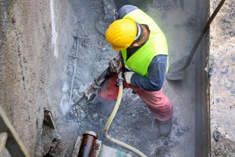 Construction worker using a jackhammer