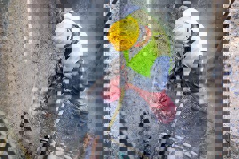 Construction worker using a jackhammer