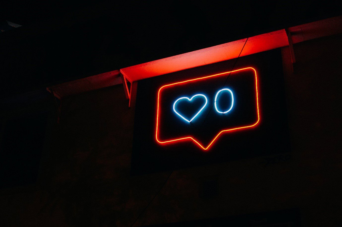 A neon sign with a heart and a zero