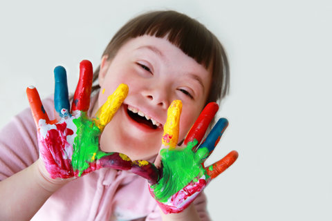 Child With Paint On Hands