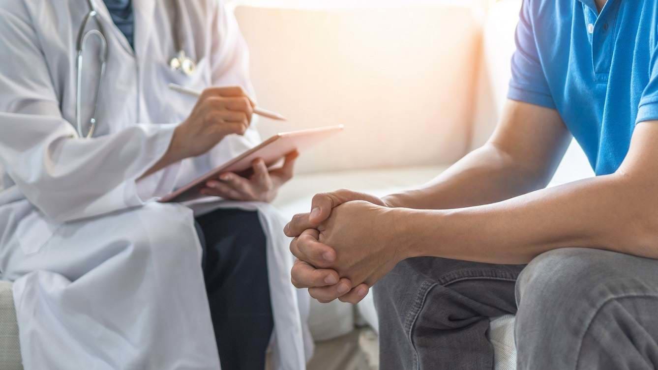 a medical professional talking with a patient