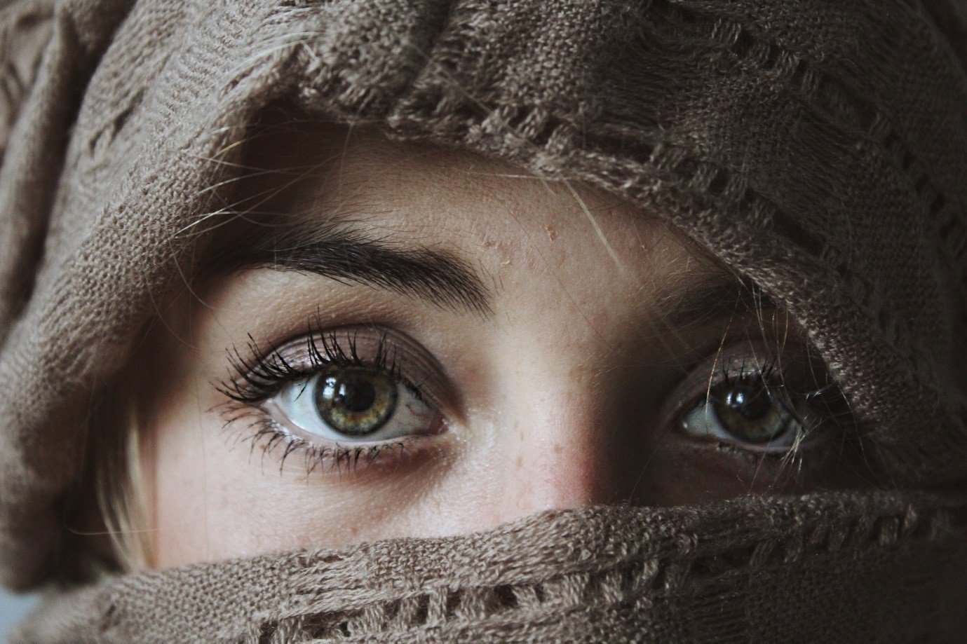 a close up of a woman's eyes