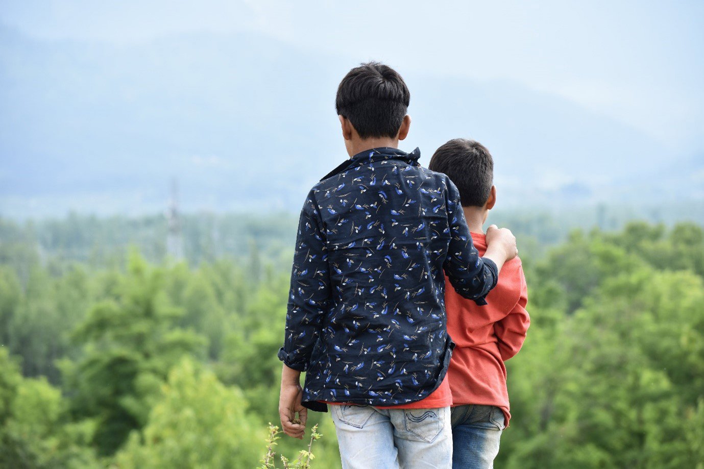 two children overlooking landscape