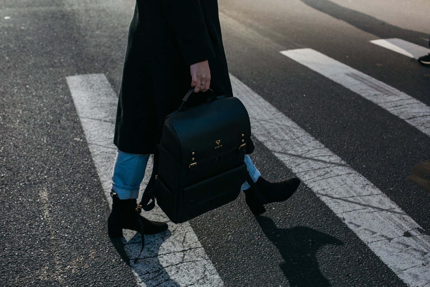 a pedestrian walking on a crossing