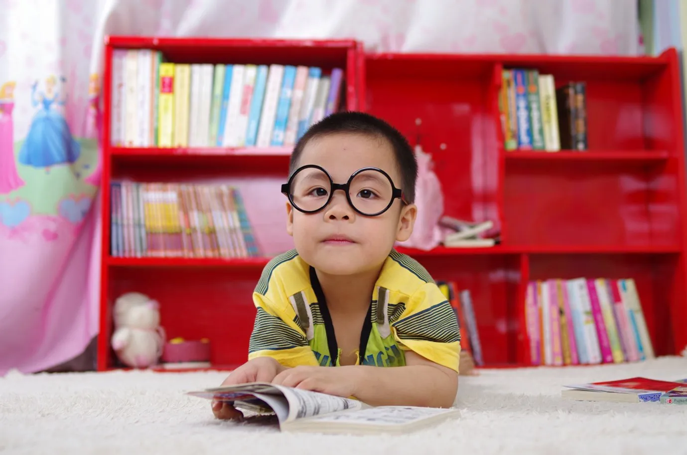 A child at school reading a book