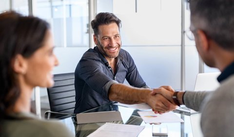 Happy man shaking hands