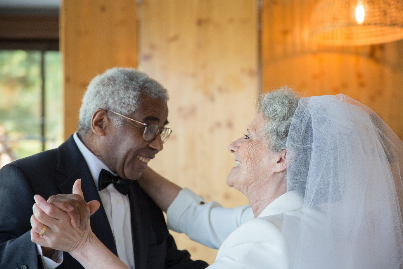 An older couple dancing at their wedding