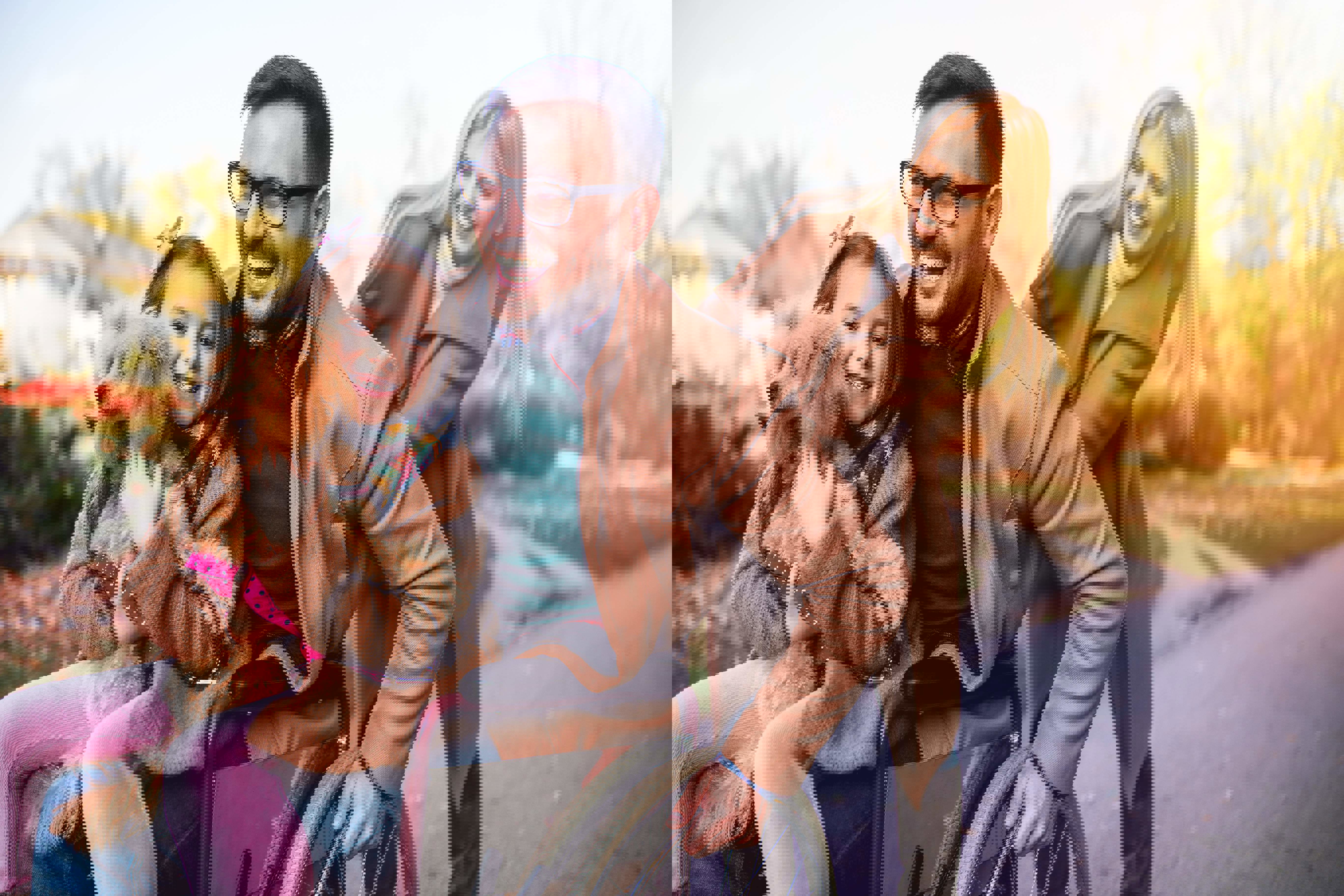 Disabled man in a wheelchair enjoying the outdoors with his wife, daughter, and dog